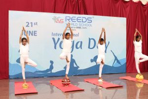 Best CBSE School in Coimbatore 41 Young students performing yoga asanas with concentration and enthusiasm.